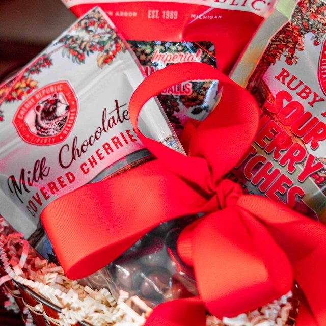 Red gift basket full of Cherry Republic products